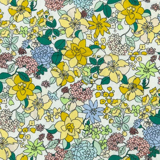 A dense floral pattern featuring yellow, blue, pink, and green flowers with green leaves on a white background.