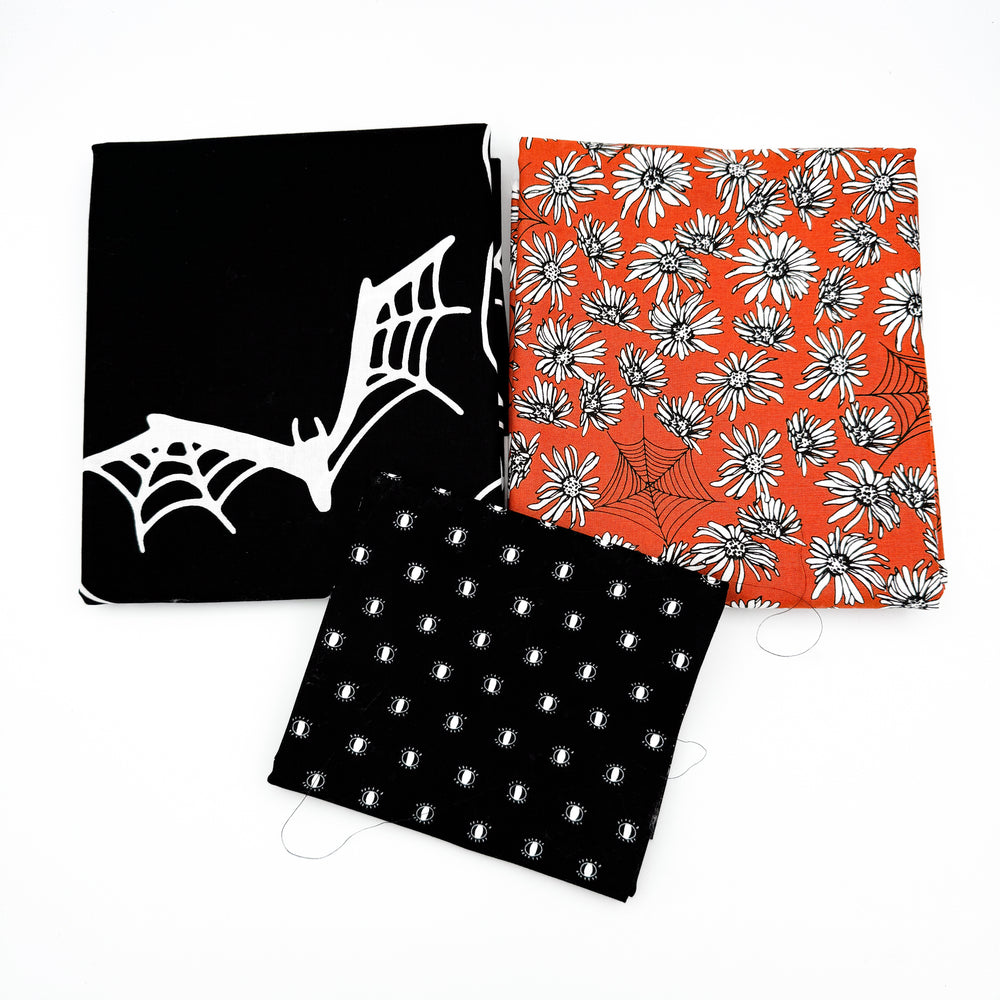 
                      
                        Cheater Quilt Kit - Noir Midnight Ghost Skull Panel and Whispering Webs Pumpkin
                      
                    