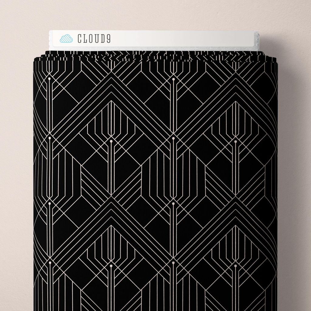 a bolt of fabric with white geometric pattern on black fabric against a white background