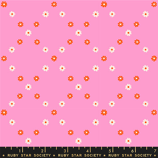 Floral pattern with small flowers on a pink background, featuring the Ruby Star Society label.