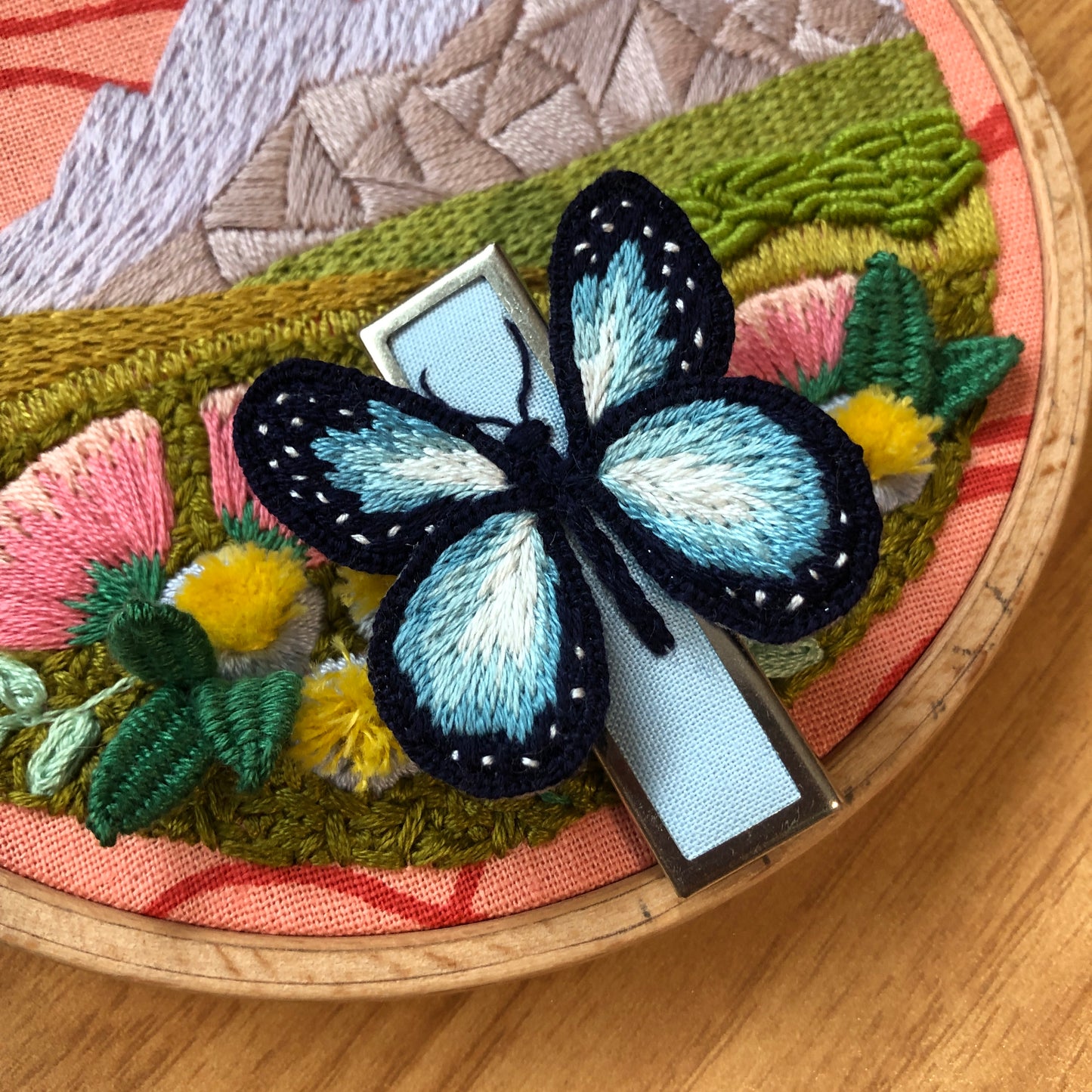 Embroidered blue and black butterfly pin made in an embroidery class at Wyldwood Creative in Renton