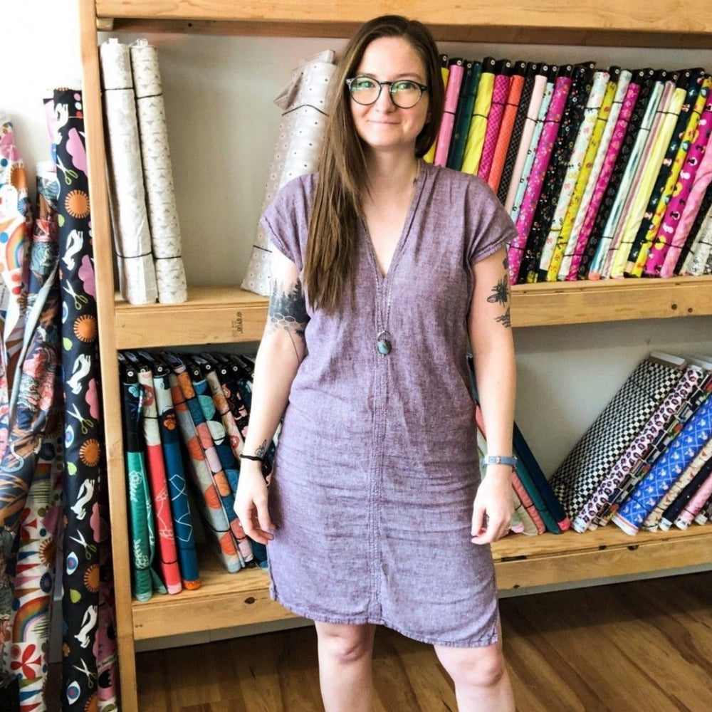 Class participant modeling her purple envelope dress she sewed in this beginners sewing class at Wyldwood Creative in Renton