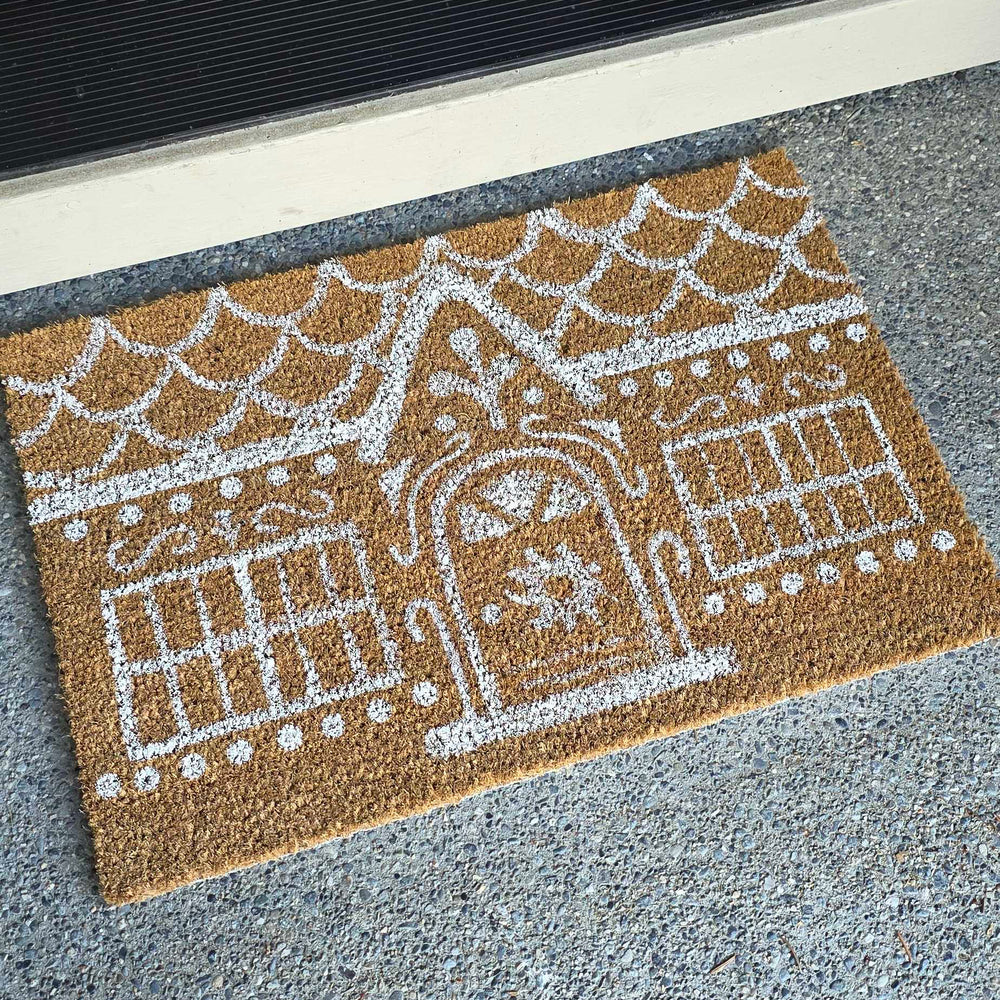 Picture of a rug painted to look like a gingerbread house