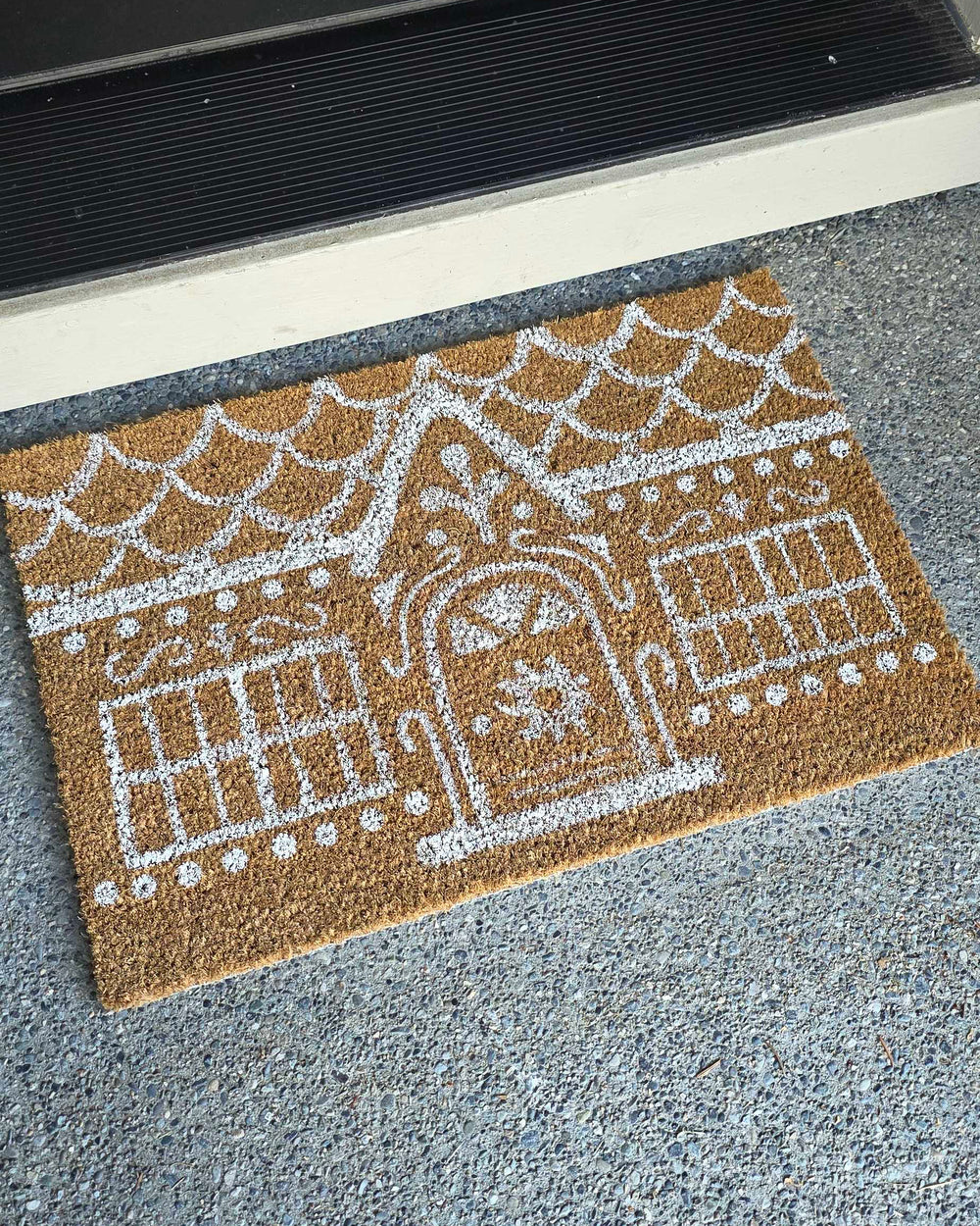 Picture of a rug painted to look like a gingerbread house