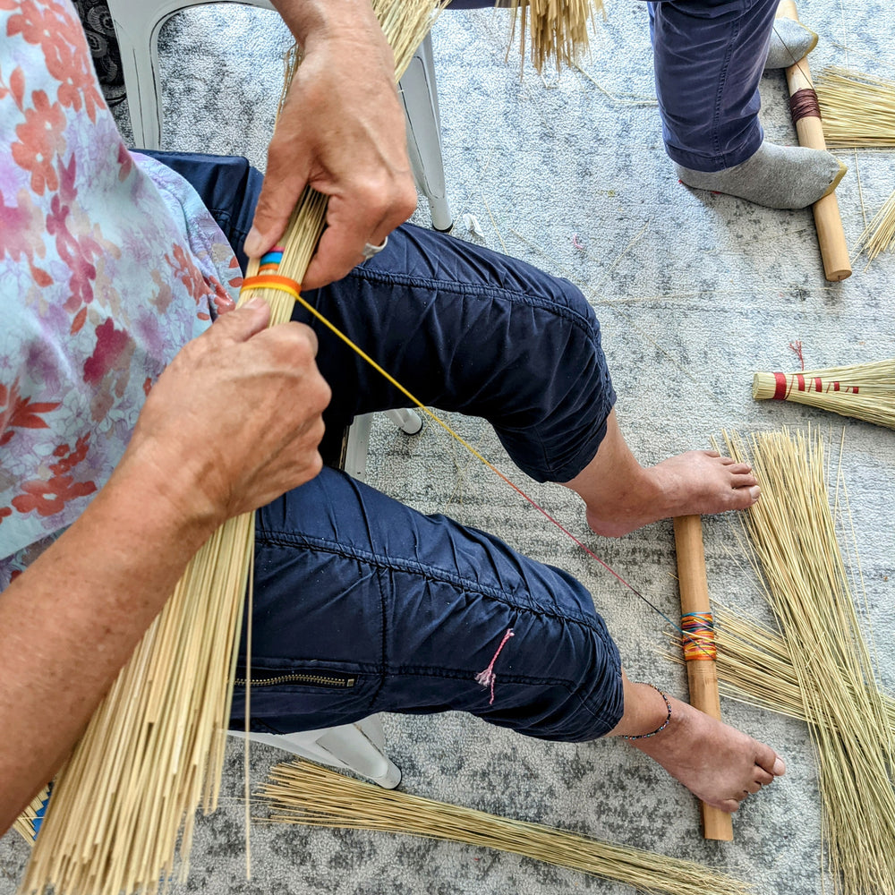 People in a crafting class at Wyldwood Creative in Renton making hand brooms.