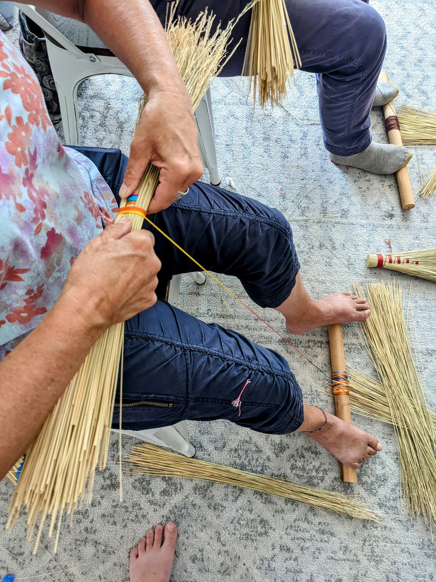 People in a crafting class at Wyldwood Creative in Renton making hand brooms.