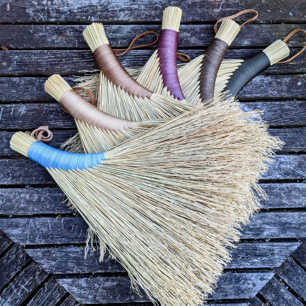 
                      
                        Fanned out stack display of hand brooms made in a crafting class at Wyldwood Creative Renton
                      
                    