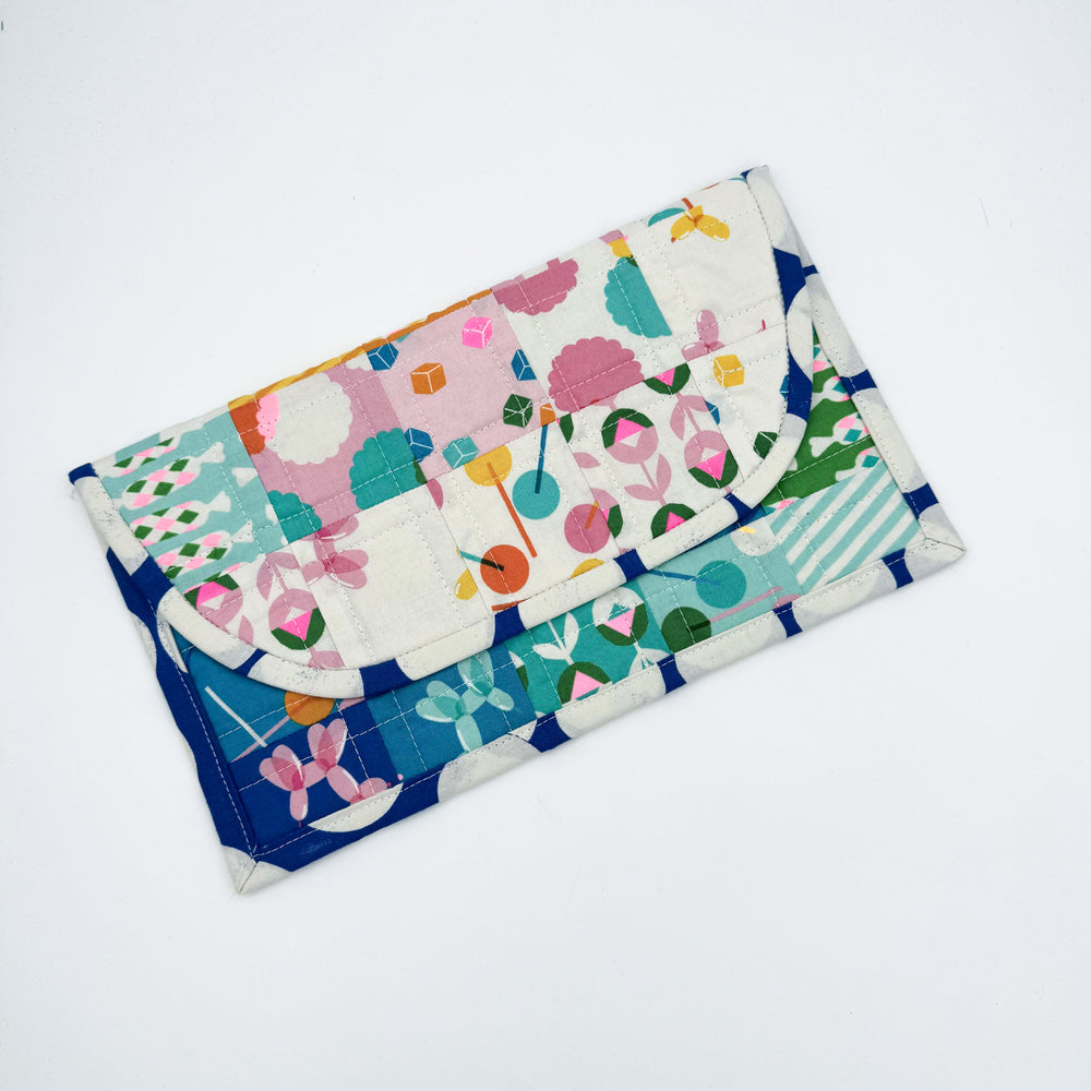 Multi prints make up a quilted look mini pouch sewn at a beginner sewing class at Wyldwood Creative in Renton