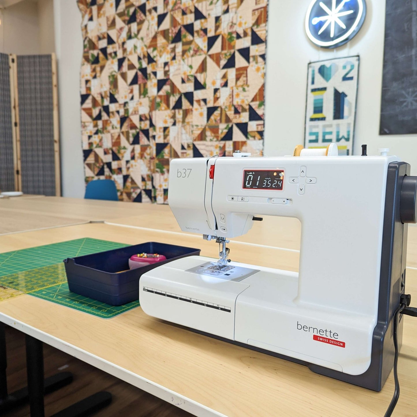 Sewing machine and tools on a table during a Makerspace Rental at Wyldwood Creative