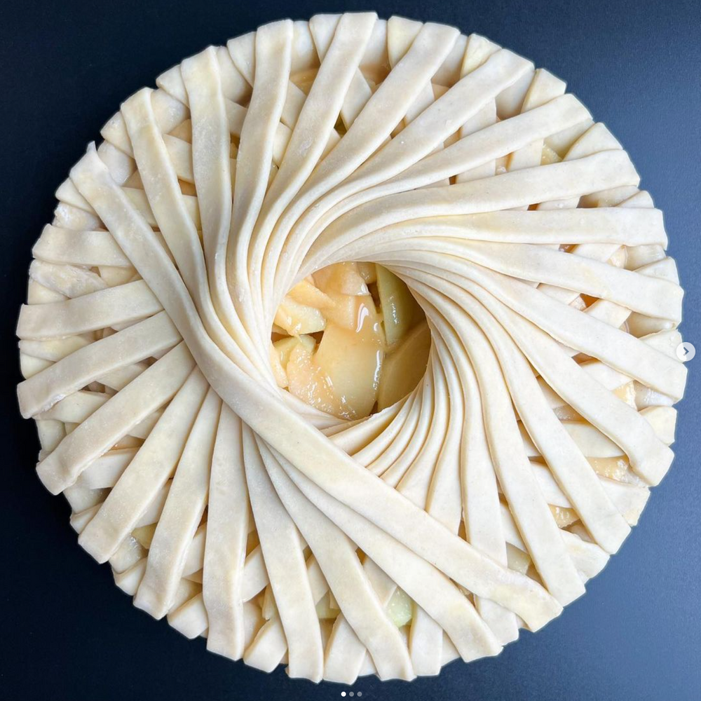 
                      
                        Elaborate twisting pie crust on top of an apple pie made at a pie making class at Wyldwood Creative in Renton
                      
                    