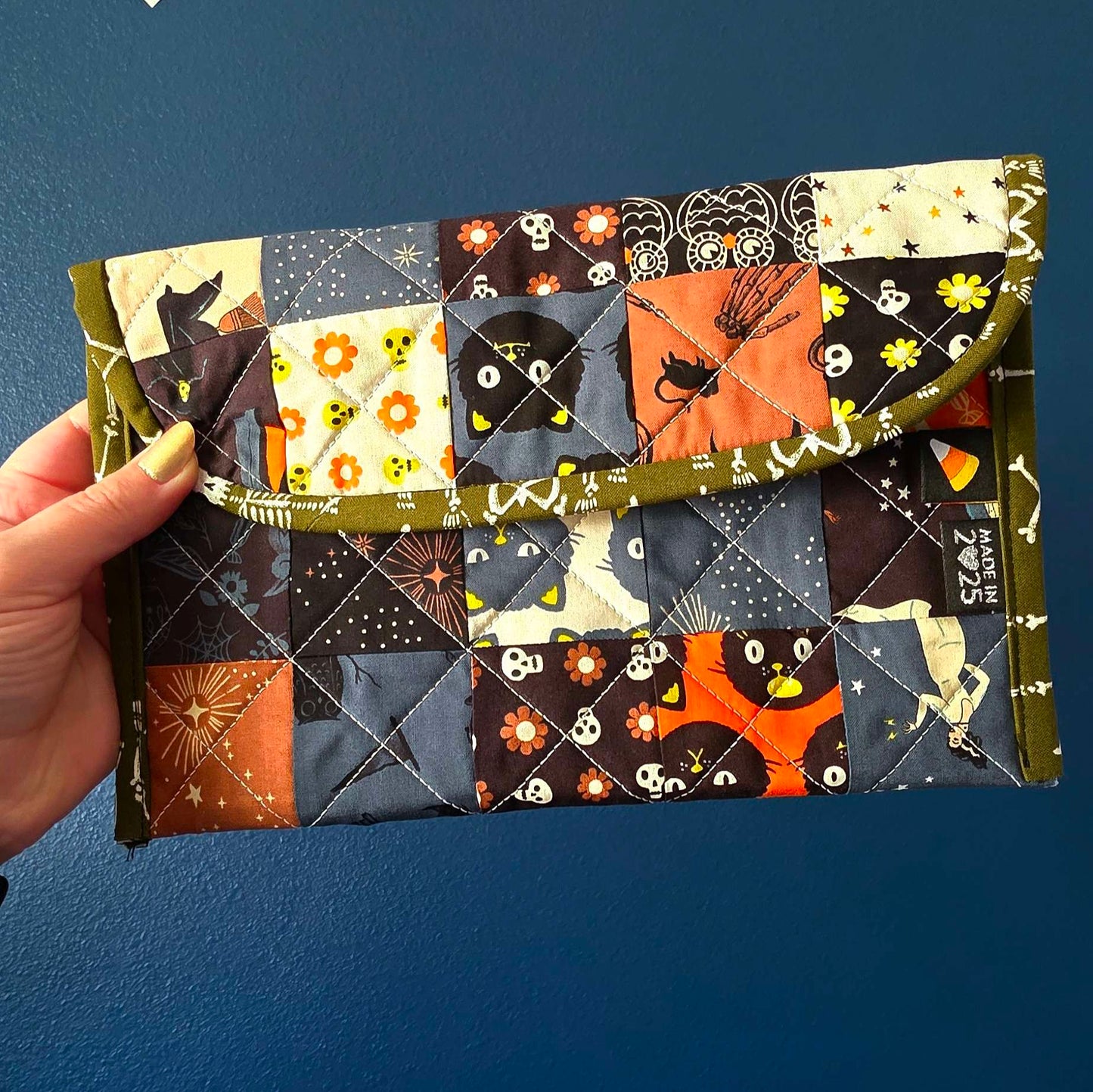 Multi prints make up a quilted look mini pouch sewn at a beginner sewing class at Wyldwood Creative in Renton