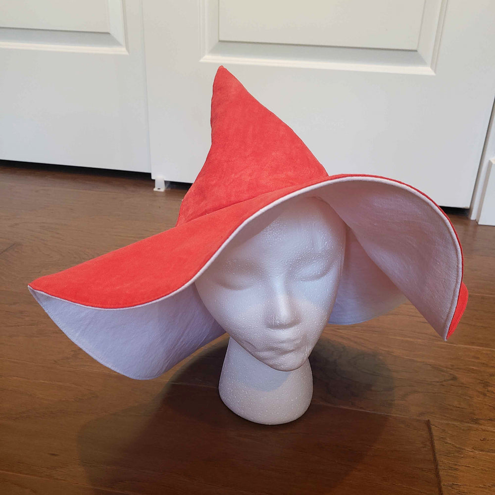 Red witch hat on a mannequin display made in a sewing class at Wyldwood Creative Renton