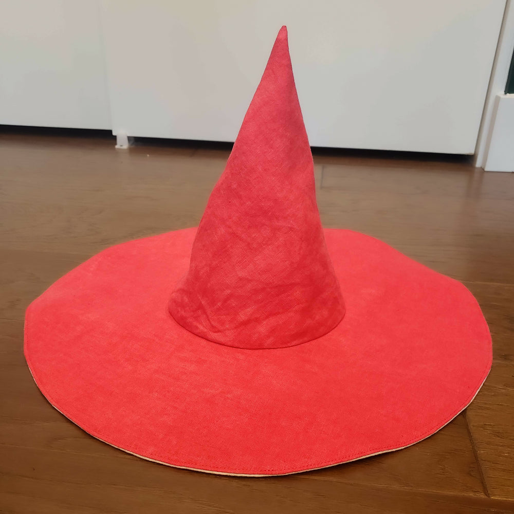 Red witch hat on a table made at a sewing class at Wyldwood Creative Renton